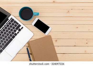 Working space. Laptop, notepad on wooden desk