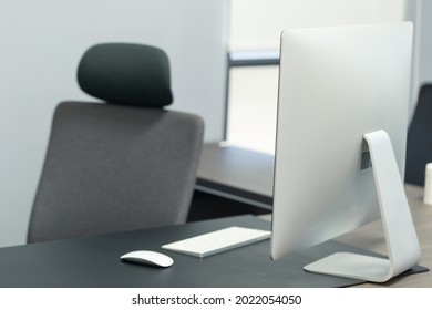 Working Space With No People. Laptop Computer Keyboard And Mouse On The Desk With Office Chair. Simple Minimal Style Office, Working Space, Home Office.