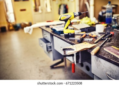 A working table with a set of tools in the workshop.