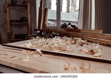 Working Table With Wood Shavings In Carpentry Workshop