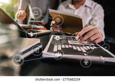 Working team meeting concept, business using laptop and smart phone and digital tablet computer with digital marketing media  in virtual icon network diagram office in morning light - Shutterstock ID 1775682254
