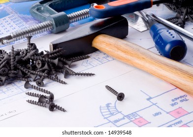 Working tools on a background of drawings