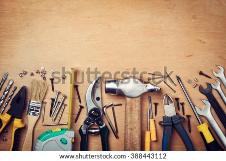 Working tools on wooden rustic background. top view
