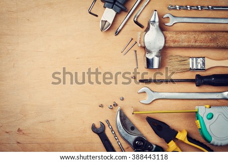 Working tools on wooden rustic background. top view