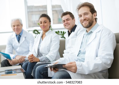 Working Well Together. Diverse Medical Practitioners Team Smiling To The Camera While Taking A Break During Their Work At The Hospital Teamwork Doctors Practitioners Professionals Staff Concept