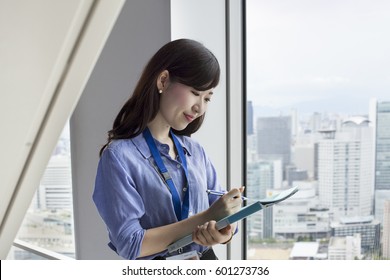 A Working Woman In An Office Building