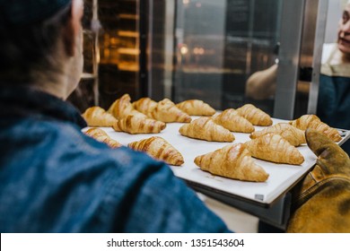 
Working woman using the bakery oven to bake the croissant of the day. Bakery concept. Lifestyle.
 - Powered by Shutterstock