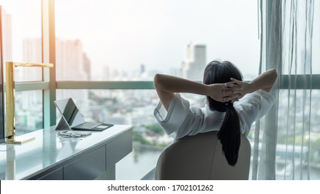 Work-life Quality Balance Concept With Happy City Lifestyle Asian Girl Having A Good Day Waking Up From Sleep In Morning Taking Some Rest, Lazily Relaxing In Comfort Home Condominium Or Hotel Bed Room