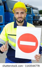workman making stop sign