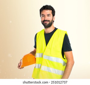 Workman over ocher background