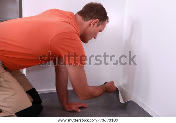 Workman Putting Down Linoleum Flooring Stock Photo Edit Now 98698109