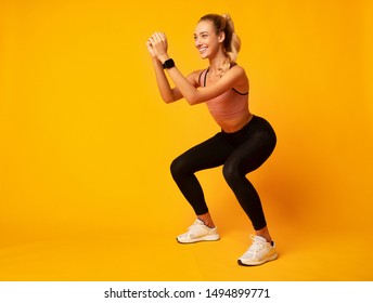 Workout Concept. Girl Doing Deep Squat Exercise On Yellow Background In Studio. Free Space - Powered by Shutterstock