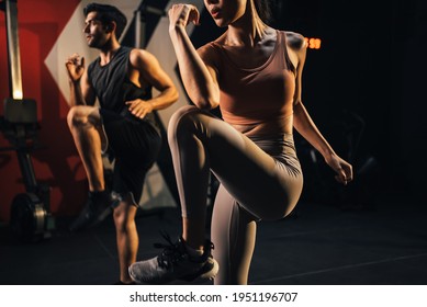 Workout couple people exercise hard squat for good shape body ay gym fitness. Fiem woman squat with trainer fitness by exercise lose weight course, muscle building course.