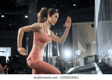 Workout, Fitness workout in gym with trainer assisted in training, Fitness concept, Fit asian woman, Young white man and asian girl exercising in the gym. - Shutterstock ID 2330323463