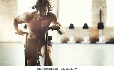 Workout, fitness and man on elliptical in gym for health, training or exercise. Sports, motivation and determined male shouting on cross trainer bike for exercising, cardio and cycling for strength. - Powered by Shutterstock