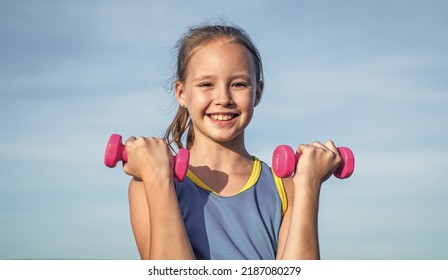 Workout Outdoor. Teen Girl Use Dumbbell. Sporty Kid In Sportswear Do Lifting Exercise.