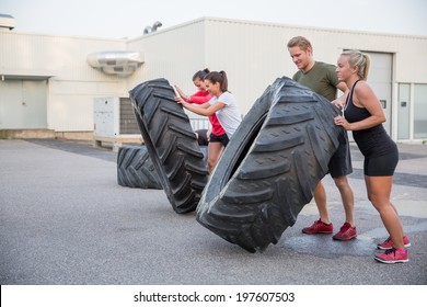 Workout Team Flipping Tires Outdoor