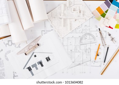 Workplace of architect. Engineering tools for creating new architectural project on table, top view