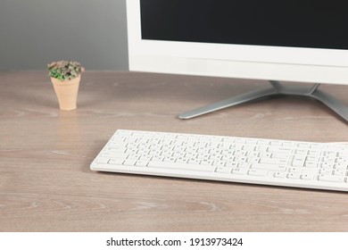 Workplace with a computer on the table in a modern room
