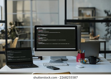 Workplace with computers with codes - Powered by Shutterstock - Get 15% off with code: PIKWIZARD15