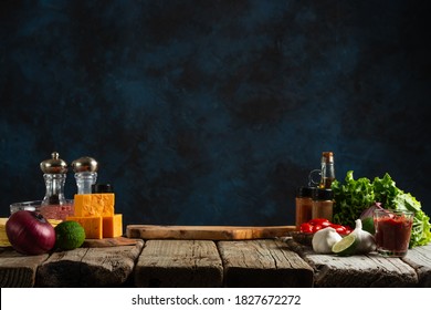 Workplace For Cooking Meal On Dark Blue Background. Backstage Of Preparing Traditional Mexican Tacos At The Professional Restaurant Kitchen. Cooking Concept.