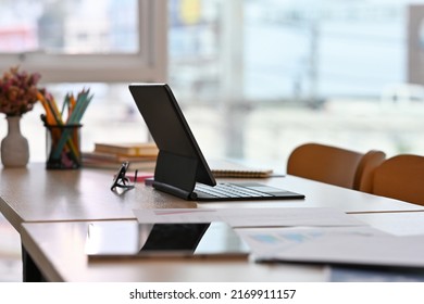 Workplace Desk With Tablets And Paperwork With No People, For Business And Technology Concept.