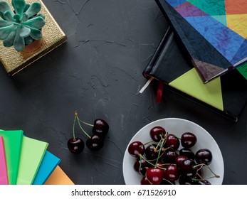 Workplace with diary, notes, flower and berries. Flat lay composition for bloggers, magazines, social media and artists. Top view.
