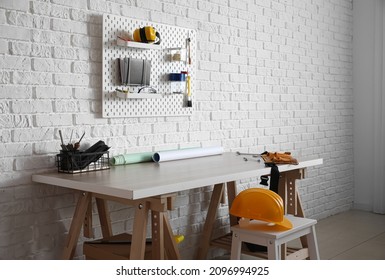 Workplace Of Engineer With Peg Board On Wall