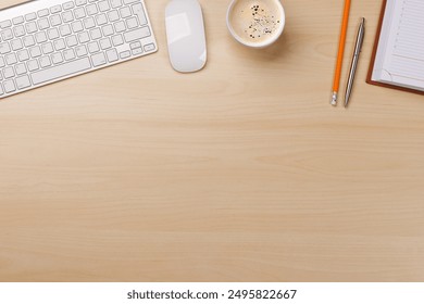 Workplace essentials: Keyboard, coffee, notepad and supplies. Flat lay with copy space