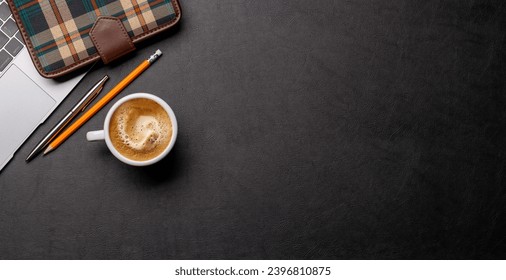Workplace essentials: Laptop, coffee, notepad and supplies. Flat lay with copy space