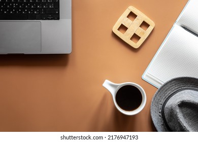 Workplace, flat lay minimalist composition with laptop and coffee cup.