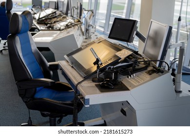 The Workplace Of The Flight Dispatcher In The Airport. Flight Control Tower. Aviation Background. Air Traffic Manager. Armchair And Remote Control With Screen. Air Traffic Controller Room.