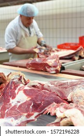 workplace food industry - factory butchery for the production of sausages - butcher cuts meat 