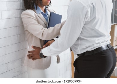 Workplace Harassment Concept. Female Secretary Trying To Stop Unwanted Sexual Advances From Her Boss In Office