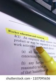 Workplace Health And Safety Employee Worker Training Legislation Yellow Highlighter Words Office Paper Keyboard Employer Compliance GHS WHMIS