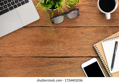 Workplace At Home With Wood Table. Top View From Above Of Laptop With Notebook And Coffee. Office Space For Modern Creative Work Of Designer. Flat Lay With Blank Copy Space. Business-finance Concept.