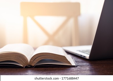 Workplace Indoor With Book Or Holy Bible And Laptop On The Wooden Desk