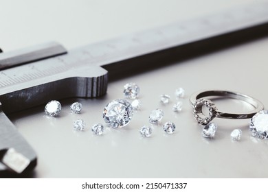 Workplace Of A Jeweler. Tools And Equipment For Jewelry Work On An Metal Desktop. Jeweller At Work On Jewelry Made Of Diamonds. Platinum Diamond Metal Background