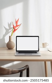 Workplace, laptop computer with blank empty white screen display monitor on desk. Mock up, copy space. Home office concept. Business, working from home, studying, e-learning, web site concept