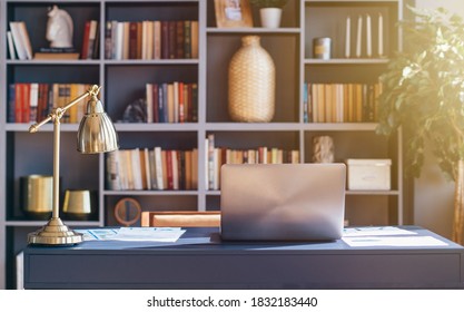 Workplace with laptop on table in office. - Shutterstock ID 1832183440