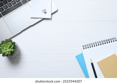 Workplace with laptop, pencil and notebook, top view 