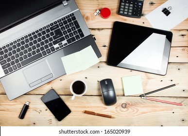 Workplace, laptop and tablet pc on wooden table - Powered by Shutterstock