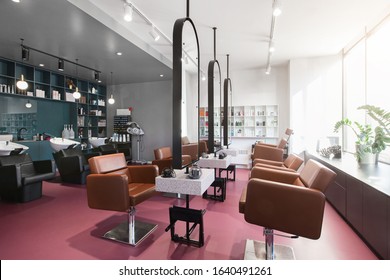 Workplace makeup artist and hairdresser. Nobody. Big mirrors and leather chairs, beauty salon interior