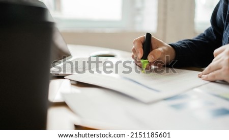 Workplace a man uses a laptop report in the company electronic documents, work with finance accountant
