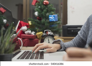 Workplace With Modern Computer And Gift Box, Christmas Tree On Desk Office.