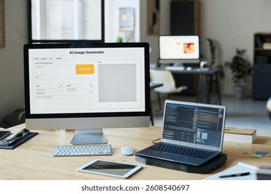 Workplace of modern designer or software developer with group of computing equipment in coworking space