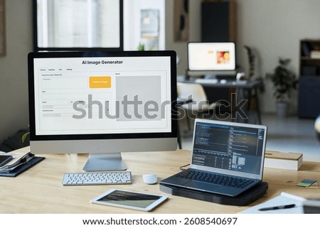 Workplace of modern designer or software developer with group of computing equipment in coworking space