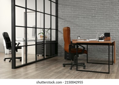Workplace Near Grey Brick Wall In Office Interior
