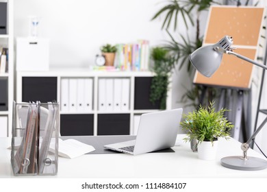 Workplace with notebook laptop Comfortable work table in office 