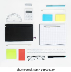 Workplace With Office Items And Business Elements On A Desk. Concept For Branding. Top View. 